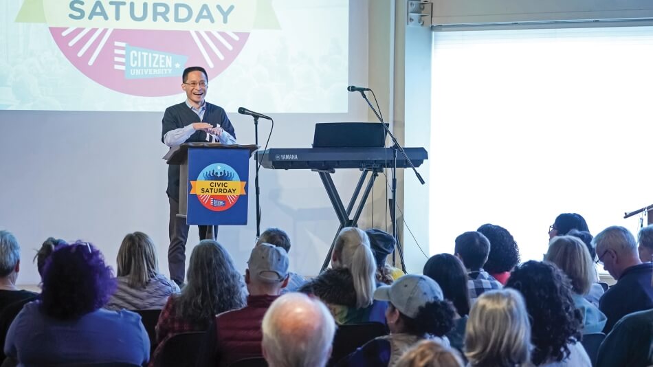 Commission Cochair Eric Liu delivers a sermon during Civic Saturday at Impact Hall in Seattle on October 5, 2019.