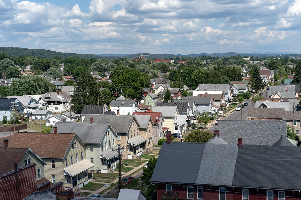 A row of homes on a quiet street, as seen from a high-up vantage point.