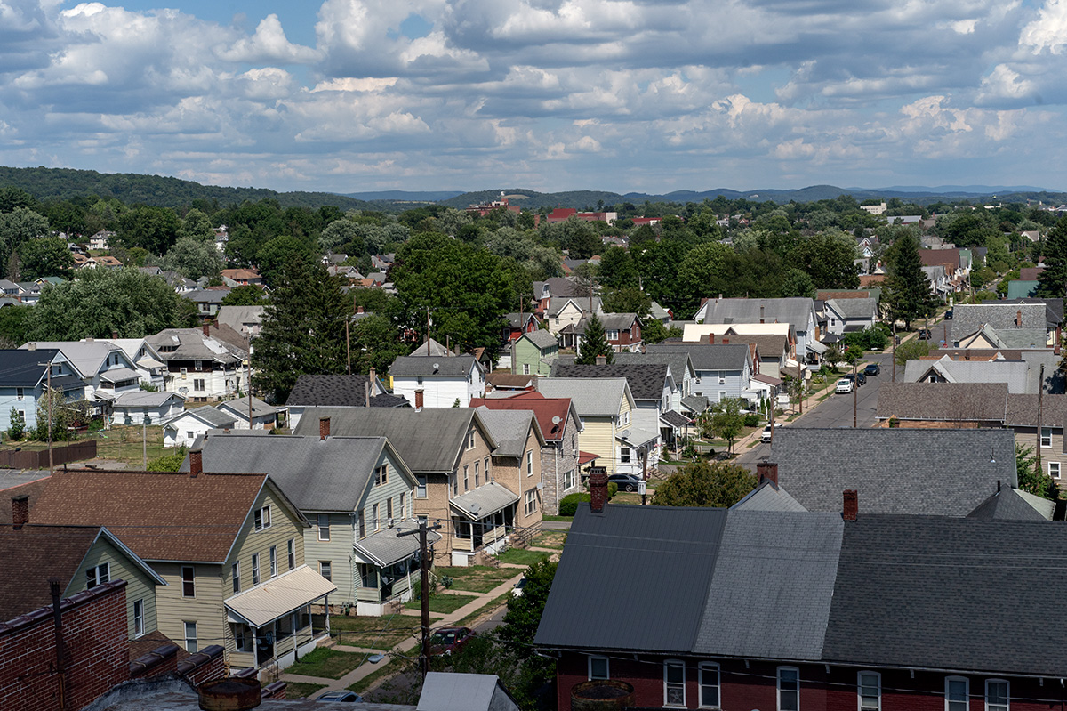 A row of homes on a quiet street, as seen from a high-up vantage point.
