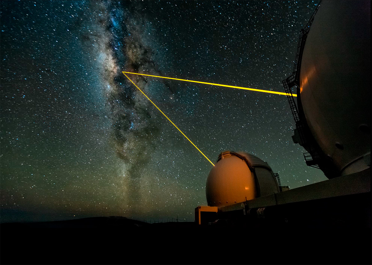 A view of the Milky Way galaxy at night seen over an observatory.