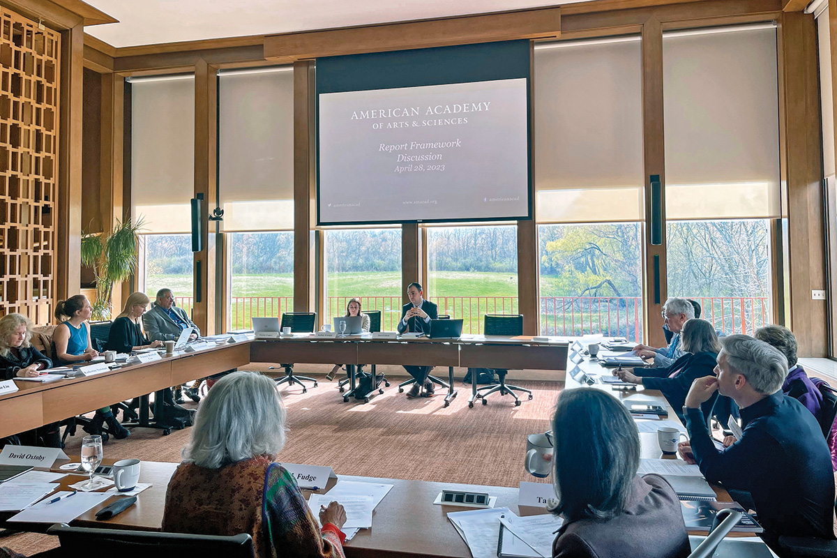 A dozen people meet in a spacious conference room in Wisconsin to discuss the framework of the Commission on Reimagining Our Economy.