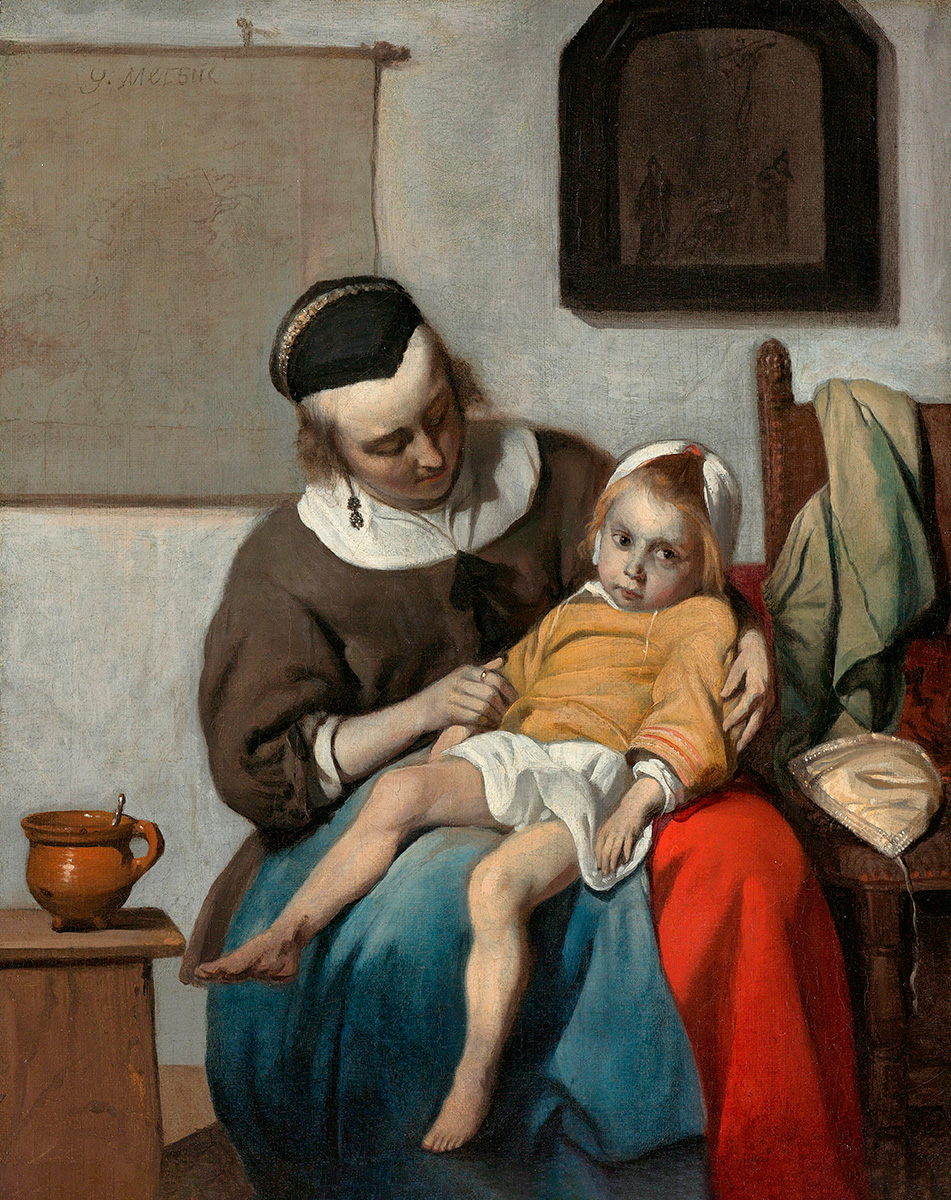 A portrait of a child sitting on a caregiver’s lap, slouching to the point of practically lying down. The caregiver looks to the child. The child looks toward the viewer.