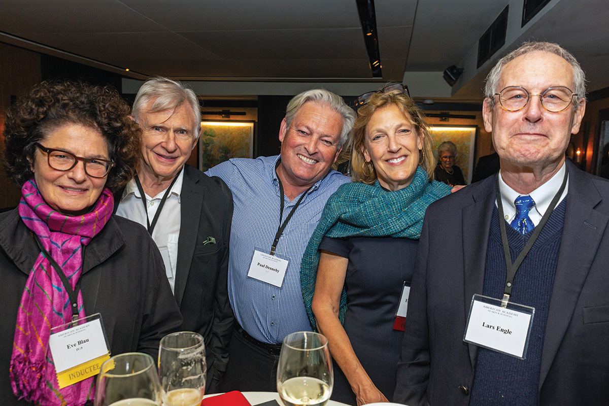 Five attendees gather at the receptions after the 2023 Induction ceremony.