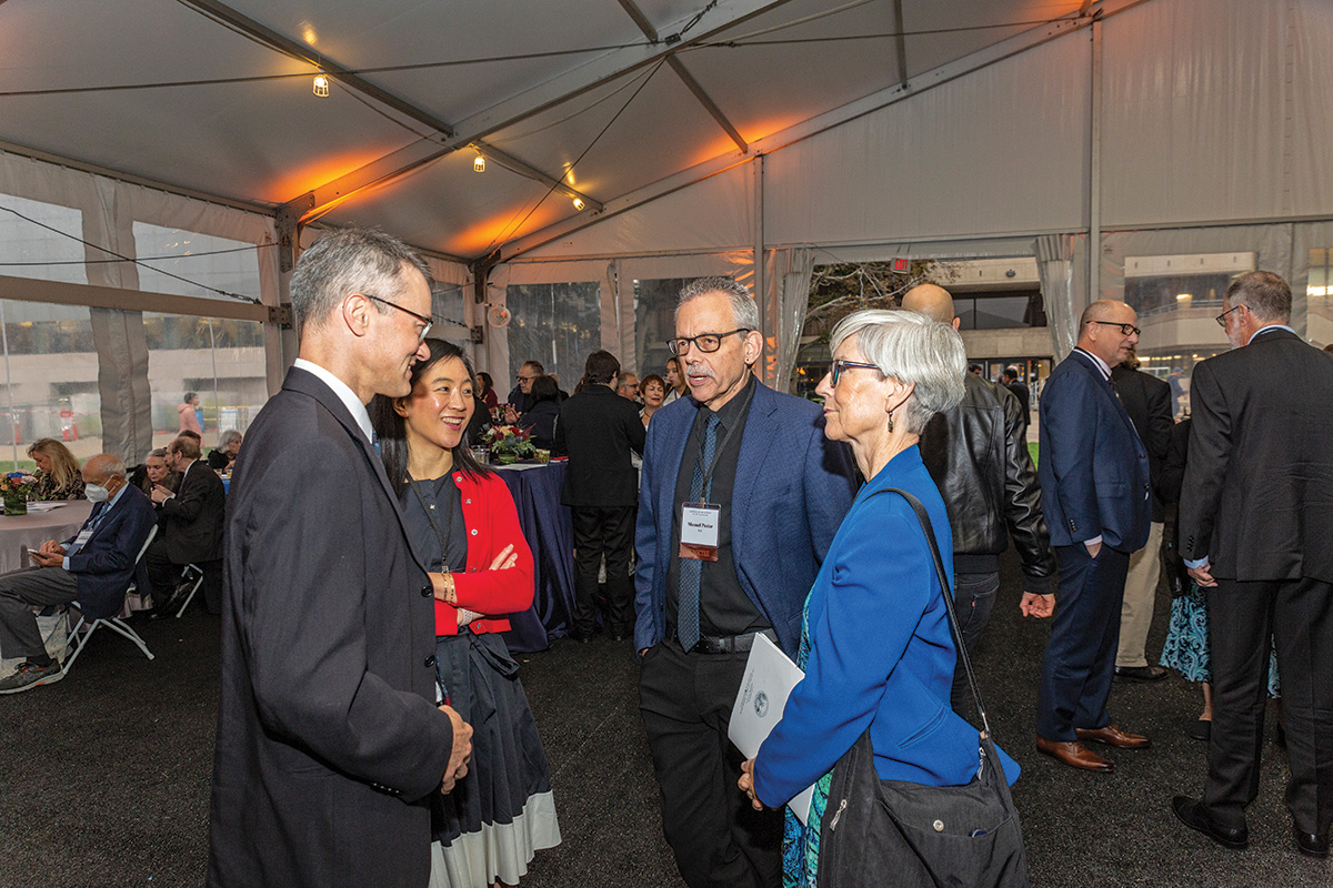 Several attendees gather at the receptions after the 2023 Induction ceremony.