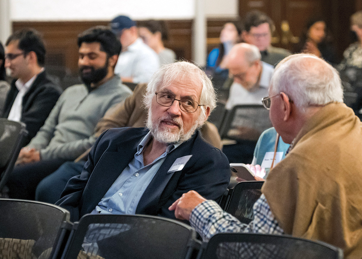An audience of people of all ages seated in rows. 