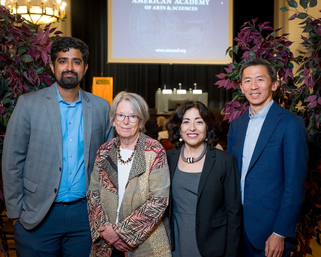 Posed portrait of the four speakers at the Berkeley event on artificial intelligence.