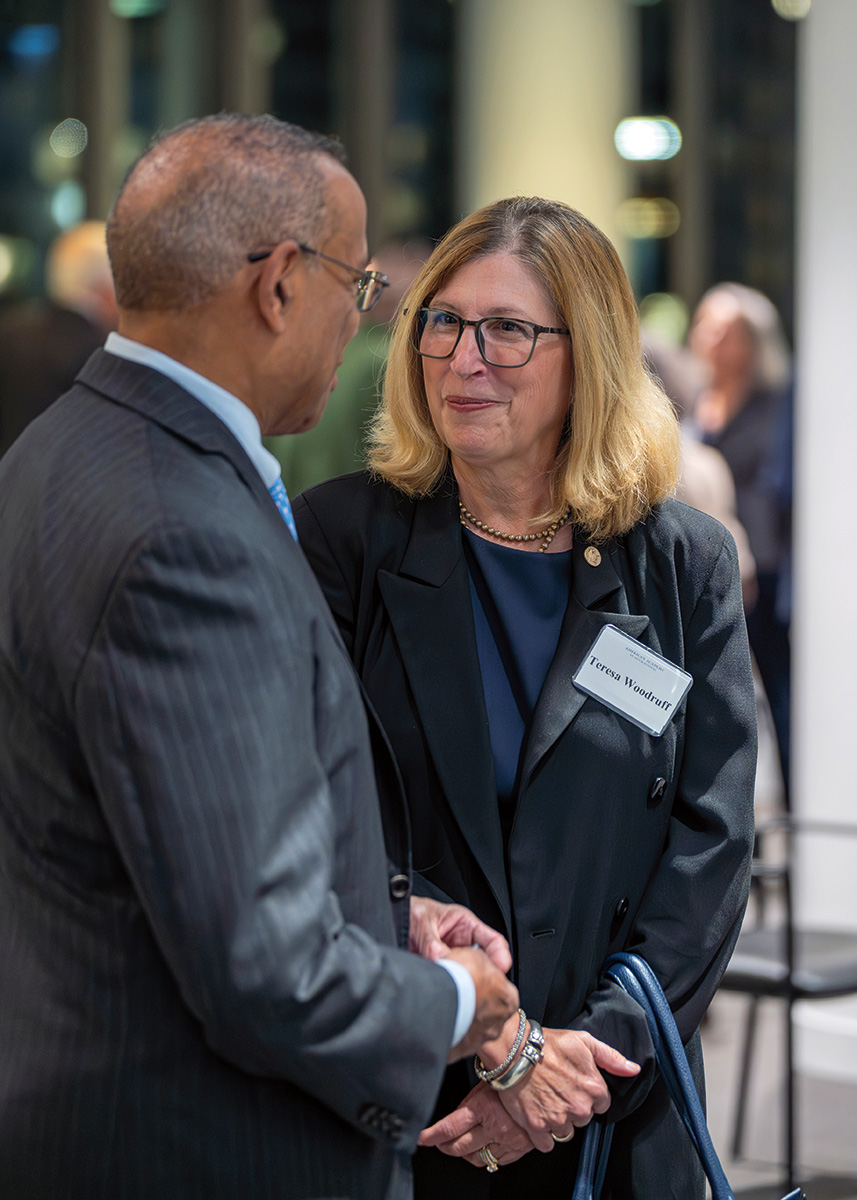 A man and woman dressed formally at an evening reception. 
