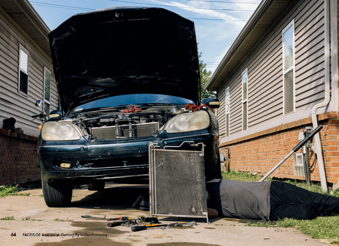 Photograph by Maen Hammad of a man fixing a cars broken AC condenser