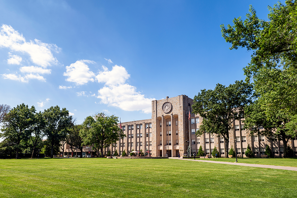 A scenic view of a university campus that shows its architecture and green spaces.