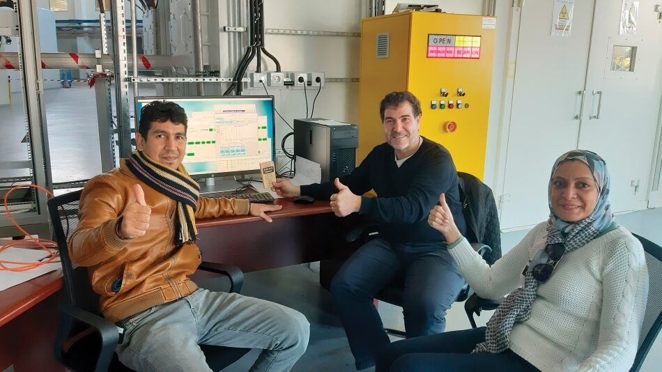 SESAME scientists just after obtaining the first monochromatic X-ray fluorescence signal on December 23, 2019 (from left to right: Mahmoud Abdellatief, MS beamline scientist, Messaoud Harfouche, XAFS/XRF beamline scientist, and Gihan Kamel, IR beamline scientist).  © 2019 by SESAME.