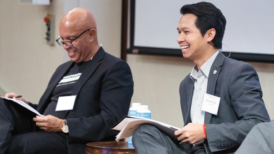 Julio Medina (left), who participated in a session about felon disenfranchisement in New York City, and Sovanna Pouv (right), who organized listening sessions with Cambodian refugees in Lowell, MA, discuss empowering voters at a meeting held at the House of the Academy.