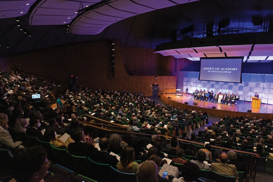 A wide shot taken from the audience of the class speakers onstage at the 2022 Induction ceremony. Photo by Michael DeStefano Photography.