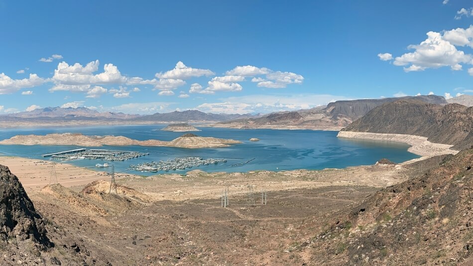 A photo of Lake Mead shows a ring of lighter soil around the lake, marking the higher volume where the water level once reached.