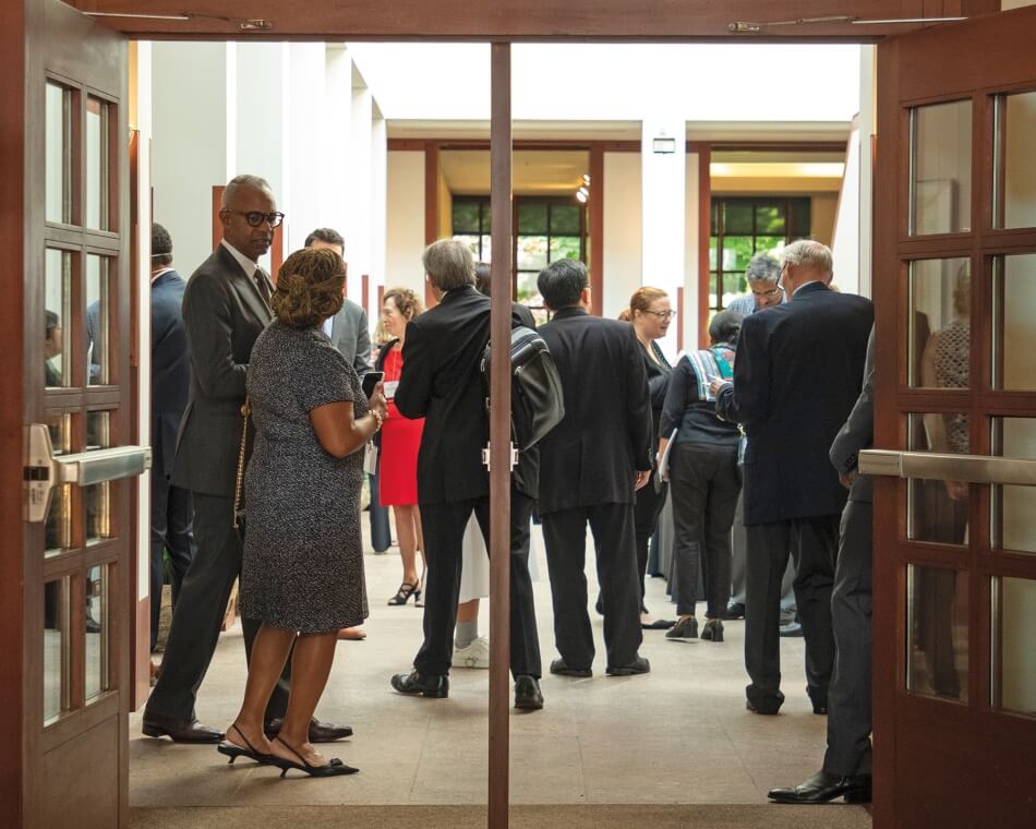 Entry to the Academy with people gathering for the open house. 