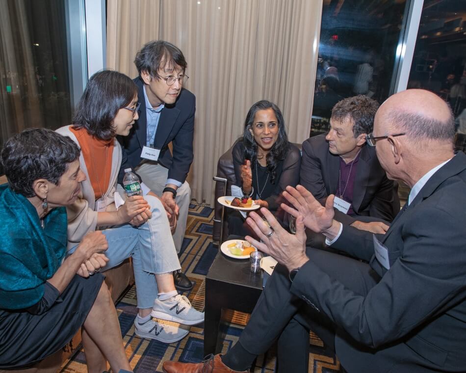 People talking at a reception. 