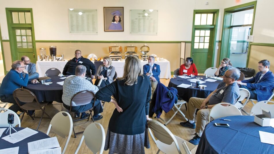 A listening session at the Moton Museum in Farmville, VA, in April 2019. Formerly R. R. Moton High School, the building is now a national historic landmark and community space, recognized for its role in the landmark Brown v. Board of Education case. In the background is a portrait of student Barbara Rose Johns, who led a student strike for equal education in 1951, when she was sixteen years old. 