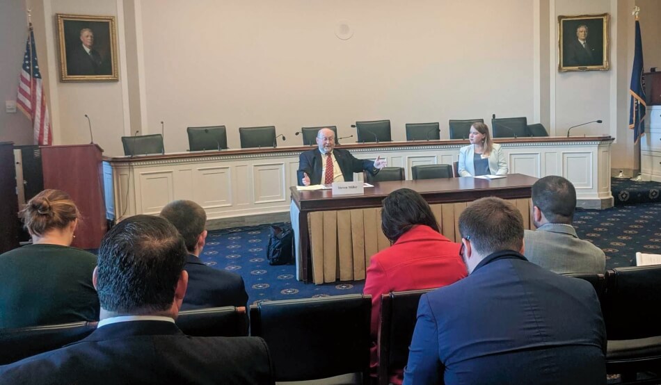 Steven Miller (Harvard University) speaking to congressional staffers, with Kathryn Moffat (American Academy) to his right. 