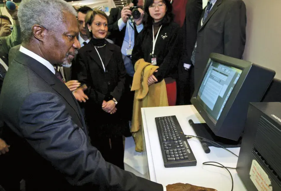 GettyImages-2798217_0.jpg In 2003, then UN Secretary General Kofi Annan sends the first message from a CERN server to students participating in the UN-sponsored World Summit on the Information Society in Geneva. © Jean-Philippe Ksiazek/Getty Images.