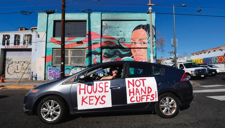 Frederic J. Brown/AFP via Getty Images “House Keys Not Handcuffs!”