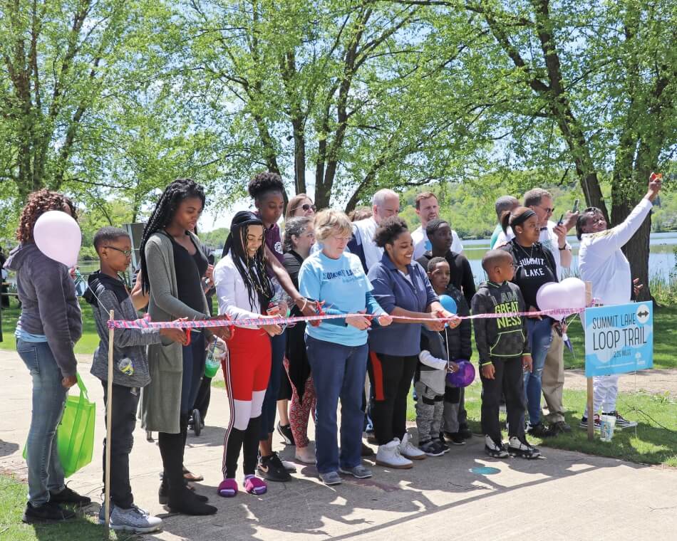 People at a ribbon cutting. Photo by Garrick Black.