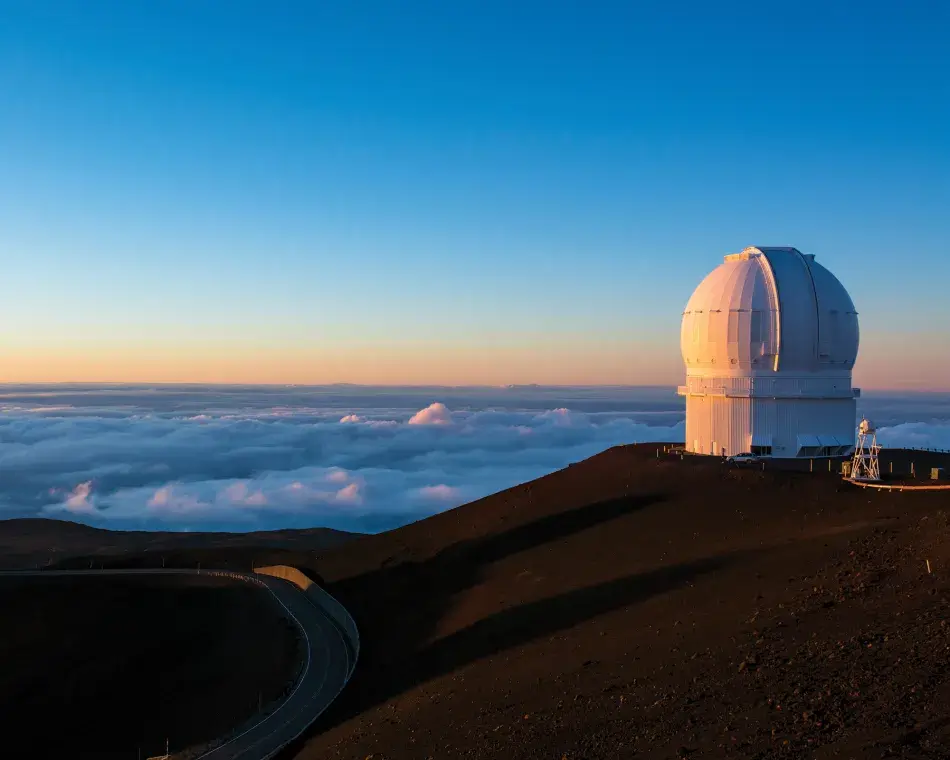 iStock.com/joebelanger Keck observatory on Mauna Kea, at 14,000 feet, on the big island of Hawaii during sunset. iStock.com/joebelanger