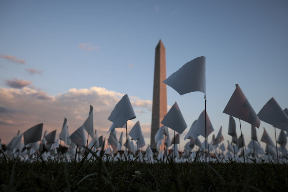 The “In America: Remember” public art installation in Washington, D.C., commemorated Americans who have died due to Covid-19. The installation, a concept by artist Suzanne Brennan Firstenberg, featured more than 650,000 small plastic flags planted in 20 acres of the National Mall.