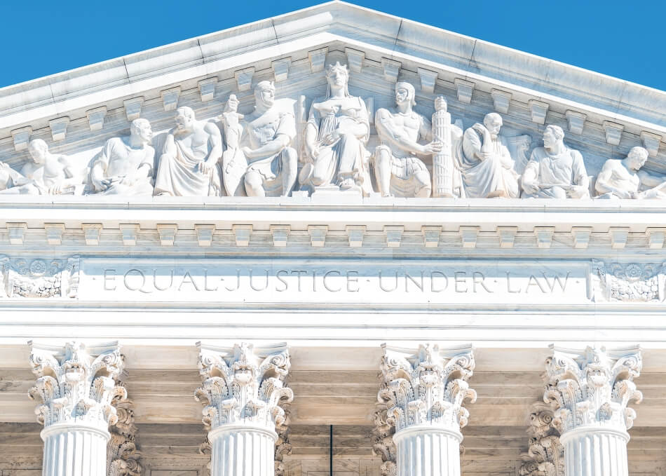 iStock.com/krblokhin Washington DC, USA exterior of Supreme Court building marble architecture and closeup on Capital capitol hill columns pillars by entrance and sign.