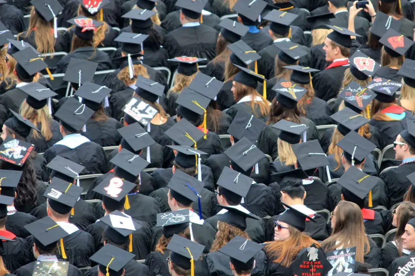 A sea of graduating students all wearing their graduation caps