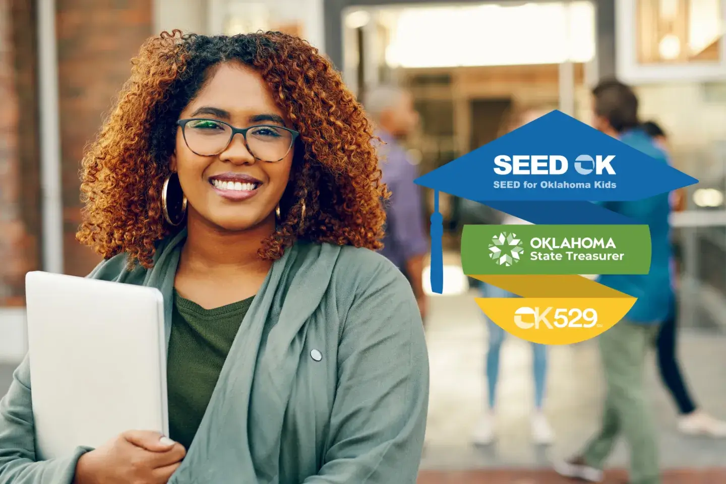 A woman holding a stack of papers posing for the camera with a graphic next to her describing the SEED for Oklahoma Kids process