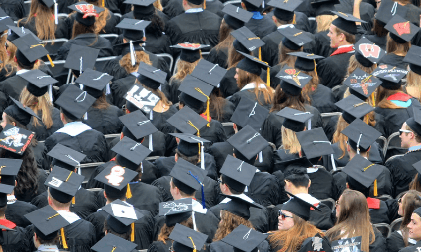 A sea of graduating students all wearing their graduation caps