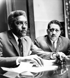 Civil rights activists Bayard Rustin and Eugene Reed speak at Freedom House