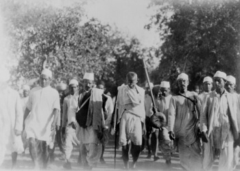 Photograph of Mahatma Gandhi leading a march to the sea to make salt in defiance of the British salt monopoly.