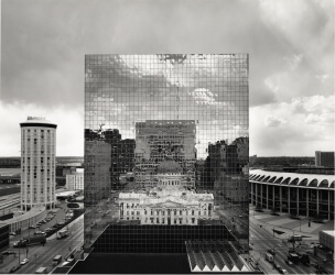 Old courthouse reflected in glass of new courthouse in St. Louis