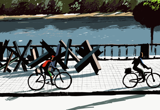 A painting of two people riding bicycles past anti-tank obstacles beside a river in Ukraine. The day is sunny and green trees stand across the riverbank.