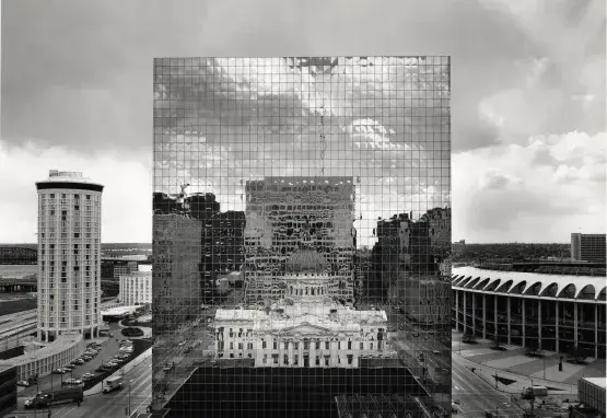Old courthouse reflected in glass of new courthouse in St. Louis