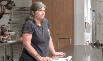 Woman Standing at Table
