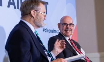 Former Rep. Philip Sharp (D-Ind.) and former Rep. Henry Waxman (D-Calif.) speak at a forum discussing lessons from the Clean Air Act.
