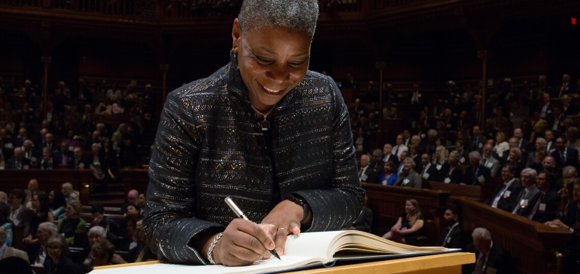 Ursula Burns Signing the Book of Members at Induction