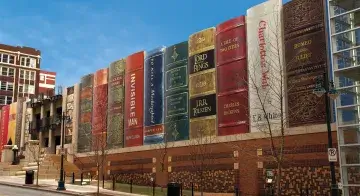 A building high series of book spines (with titles ranging from the Tao Te Ching to Romeo and Juliet) adorns the exterior of the Kansas City Public Library parking garage.