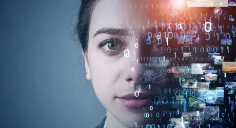 Woman's face looking ahead with layers of binary number and photographic images superimposed on half her face. 