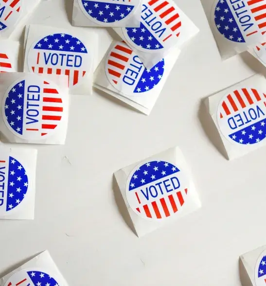 Array of red, white, and blue stickers with the text "I Voted" on them.
