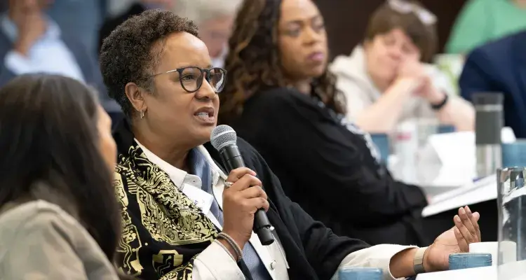 A person with a mic asks a question 