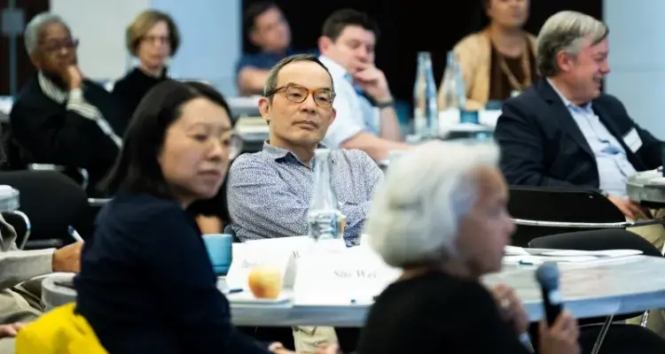 Audience, including Xuedong Huang (Zoom), at the Forum on the Future of Higher Education. 
