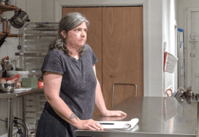 Woman Standing at Table