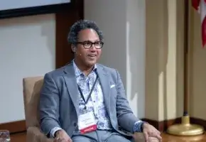 Neuroscientist Andre Fenton seated and in conversation.