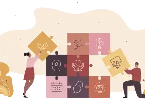 Two people assemble large, colorful puzzle pieces with icons representing different skills and ideas, symbolizing teamwork and collaboration.