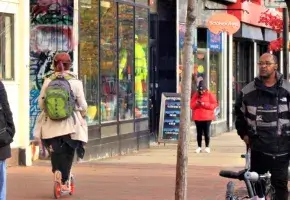 Photograph of People in Central Square in Cambridge Massachusetts from WGBH News Item