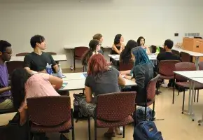 Students and Teacher in College Classroom 