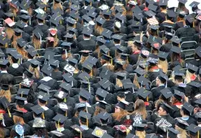 College Graduation with Mortarboards Everywhere